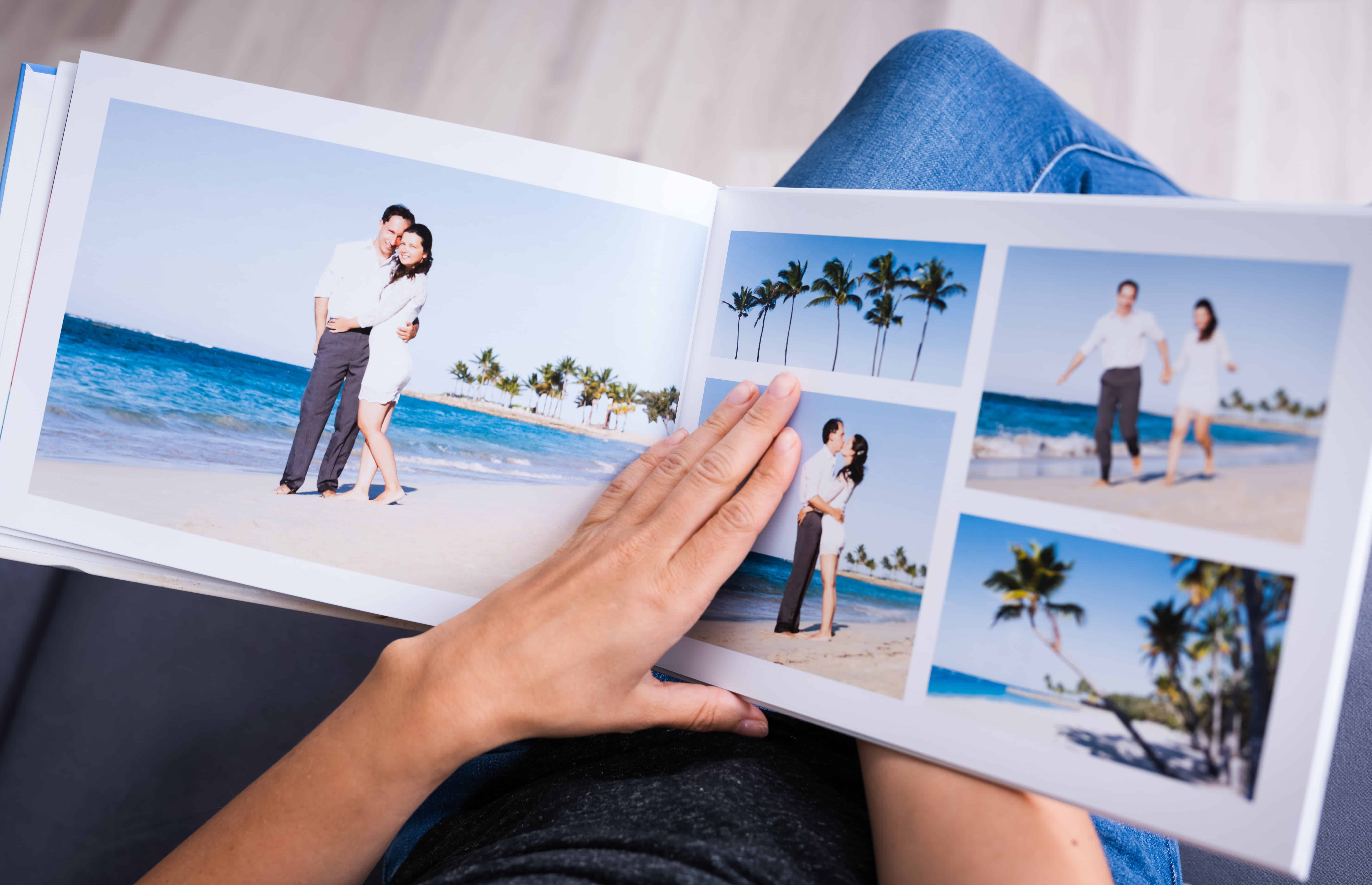 open photo book with pic of couple at beach